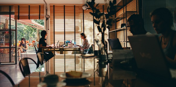 Canva - Two Women Sitting on Chairs in Front of Each Other